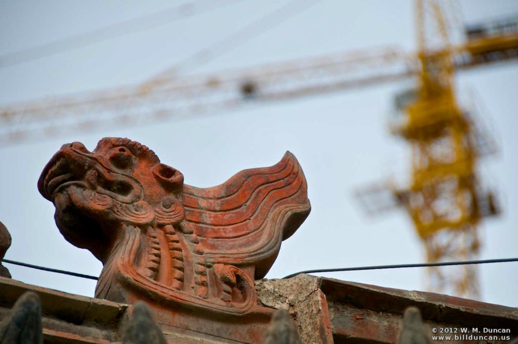 Modern construction will soon eclipse decaying temple.
