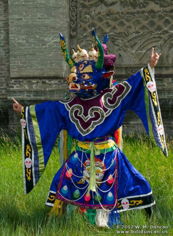 Members of the opera company perform a tsam-mask ceremony.