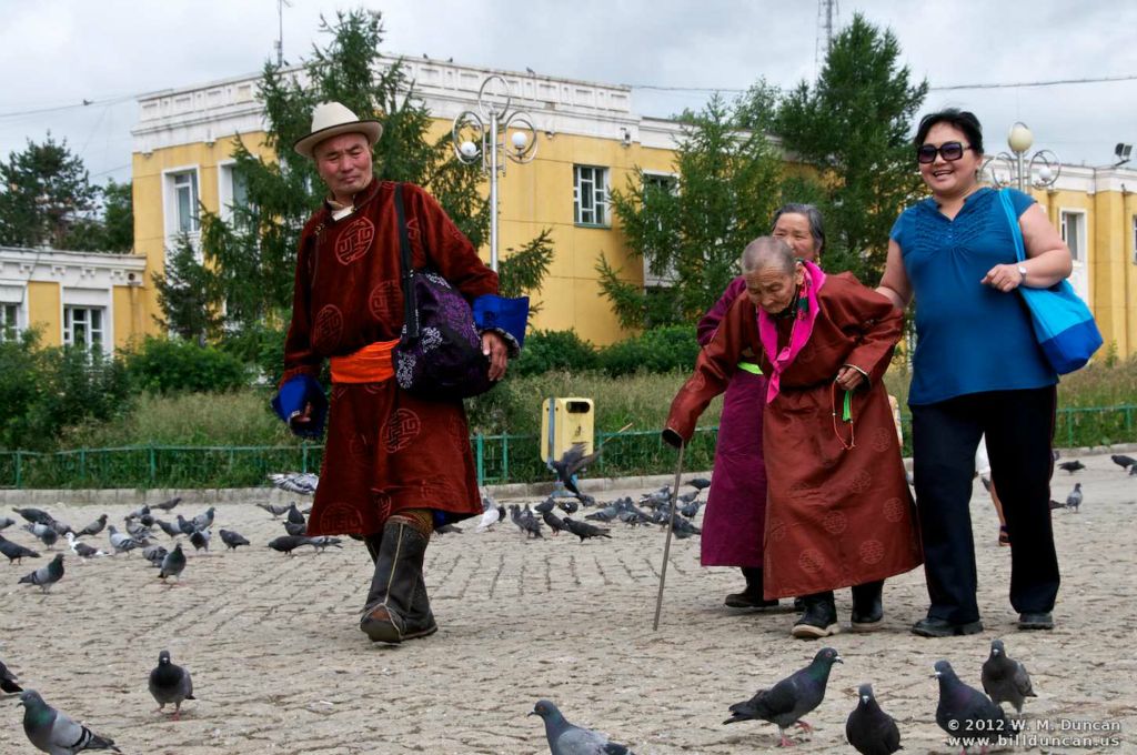 Rural edlerly in traditional garb visiting the temple and monastery.