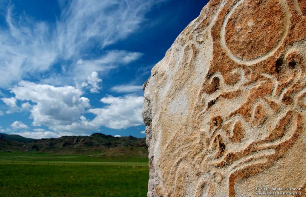 Petroglyphs of flying deer (reindeer?) on deer stone near Murun.