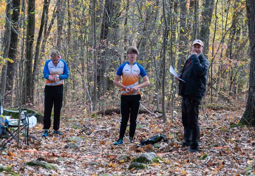 Competitors ready to begin are  released in intervals to advance toward stations to pick up maps and clue sheets.