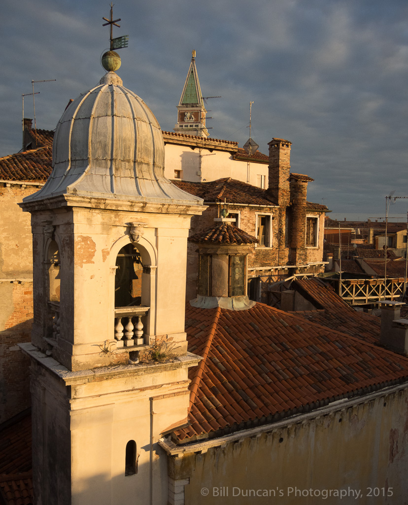 View from a hotel's rooftop bar at sunset